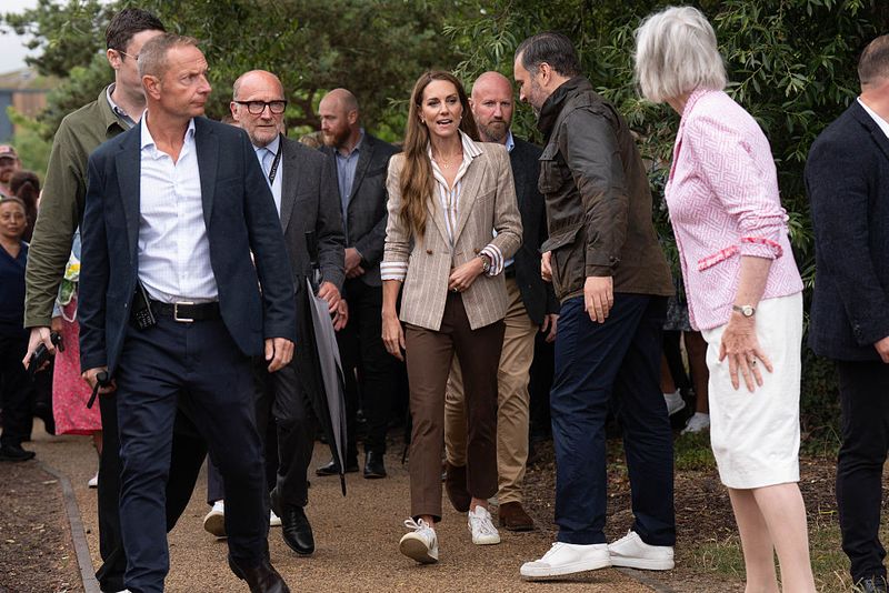 COLCHESTER, ENGLAND - JULY 2: Catherine, Princess of Wales gestures during a visit to the RHS's Wellbeing Garden at Colchester Hospital on July 2, 2025 in Colchester, England. The visit coincides with the donation of 50 Catherine's Rose plants, named after the princess by the RHS with funds from sales going to the Royal Marsden Cancer Charity. (Photo by Stefan Rousseau - WPA Pool/Getty Images)
