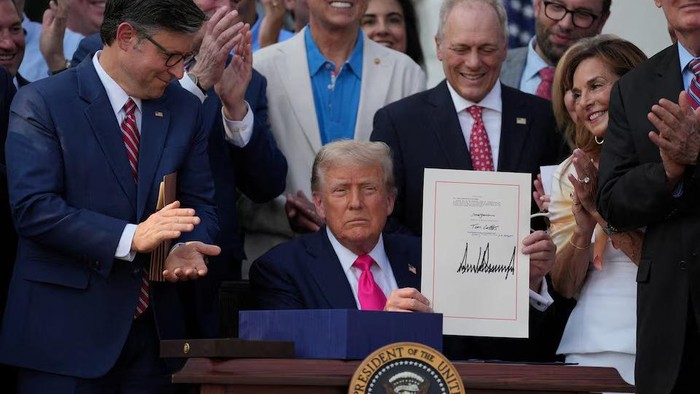 U.S. President Donald Trump presents a sweeping spending and tax legislation, known as the One Big Beautiful Bill Act, after he signed it, at the White House in Washington, D.C., U.S., July 4, 2025. REUTERS/Leah Millis Purchase Licensing Rights