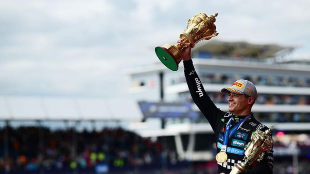 NORTHAMPTON, ENGLAND - JULY 06: Race winner Lando Norris of Great Britain and McLaren on the podium with his trophy during the F1 Grand Prix of Great Britain at Silverstone Circuit on July 06, 2025 in Northampton, England. (Photo by Mario Renzi - Formula 1/Formula 1 via Getty Images)
