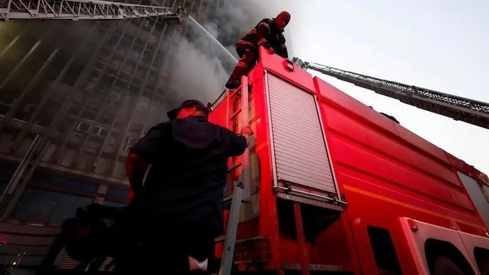 Firefighters work to extinguish a fire that erupted in a telecommunications building in the Ramses district of downtown Cairo, Egypt July 7, 2025. (Reuters)