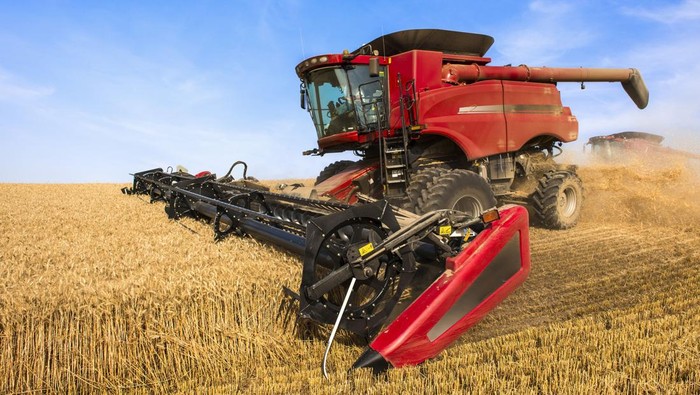 2163462774 A Combine Harvesting Grain In The Palouse Region Of Eastern Washington; Washington, United States Of America. (Photo by: Rick Dalton/Design Pics Editorial/Universal Images Group via Getty Images)