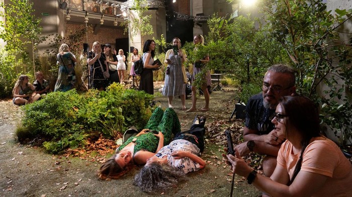 People visit an art installation that transformed a 14th century church of St. John into an urban forest, in Gdansk, Poland, July 2, 2025. REUTERS/Lukasz Glowala