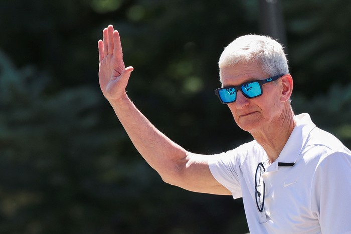 CEO of Apple Tim Cook waves as he attends the Allen and Company Sun Valley Media and Technology Conference at The Sun Valley Resort in Sun Valley, Idaho, U.S., July 10, 2025. REUTERS/Brendan McDermid