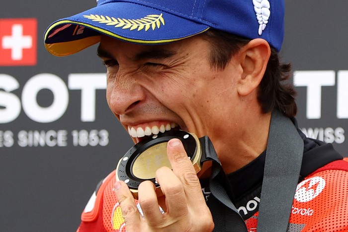 MotoGP - German Grand Prix - Sachsenring, Hohenstein-Ernstthal, Germany - July 12, 2025 Ducati Lenovo Teams Marc Marquez celebrates with his medal after winning the sprint race REUTERS/Lisi Niesner
