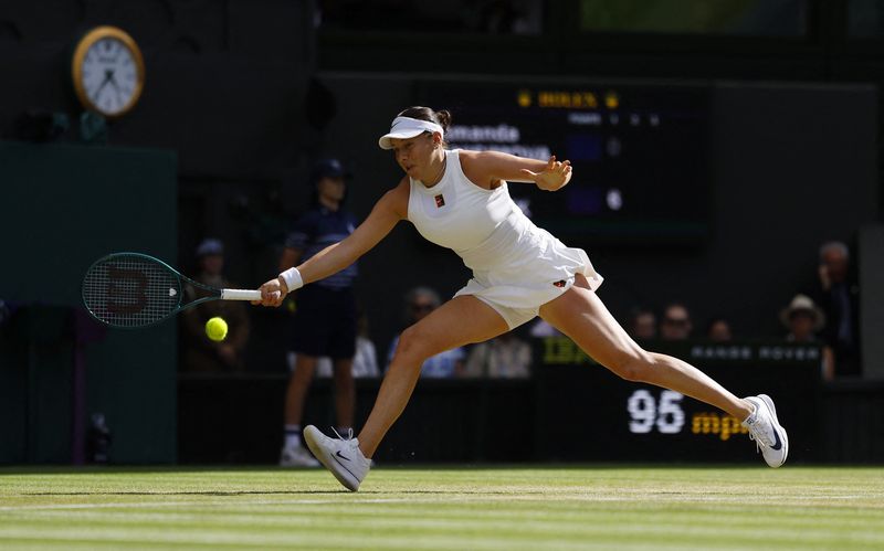 Tennis - Wimbledon - All England Lawn Tennis and Croquet Club, London, Britain - July 12, 2025 Amanda Anisimova of the U.S. in action during the women's singles final against Poland's Iga Swiatek REUTERS/Stephanie Lecocq