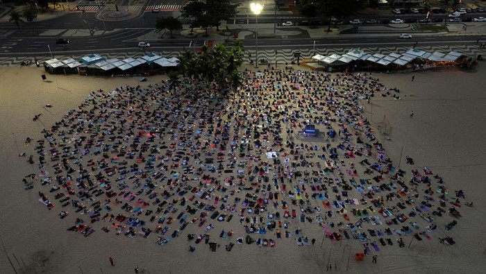 A drone view shows people during a massive yoga class, of the 