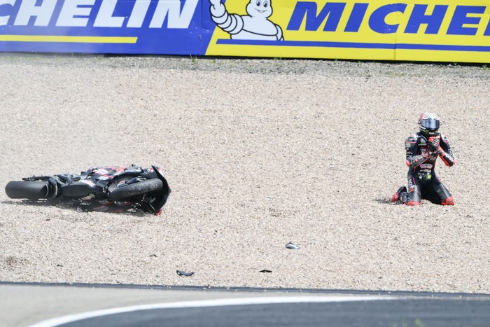 HOHENSTEIN-ERNSTTHAL, GERMANY - JULY 13: Marco Bezzecchi of Italy riding the Aprilia Racing bike (72) crashes out during the the MotoGP of Germany race at Sachsenring Circuit on July 13, 2025 in Hohenstein-Ernstthal, Germany. (Photo by Gold & Goose Photography/Getty Images)