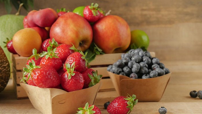 Fresh fruits. Healthy food. Mixed fruit, apricots and peaches. Blueberry. various fruits on an old wooden table. Organic healthy assorted fruits. place for text