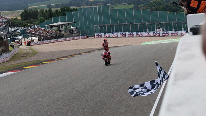 HOHENSTEIN-ERNSTTHAL, GERMANY - JULY 13: Marc Marquez of Spain and  Ducati Lenovo Team
 cuts the finish lane and celebrates the victory at the end of the the MotoGP race during the MotoGP Of Germany - Race at Sachsenring Circuit on July 13, 2025 in Hohenstein-Ernstthal, Germany. (Photo by Mirco Lazzari gp/Getty Images)
