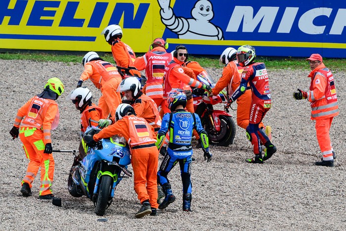 HOHENSTEIN-ERNSTTHAL, GERMANY - JULY 13: Joan Mir of Spain riding the Honda HRC Castrol bike (36) and Ai Ogura of Japan riding the Trackhouse MotoGP Aprilia (79) crash out during the the MotoGP of Germany race at Sachsenring Circuit on July 13, 2025 in Hohenstein-Ernstthal, Germany. (Photo by Gold & Goose Photography/Getty Images)