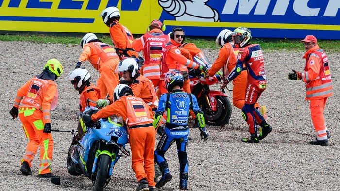 HOHENSTEIN-ERNSTTHAL, GERMANY - JULY 13: Joan Mir of Spain riding the Honda HRC Castrol bike (36) and Ai Ogura of Japan riding the Trackhouse MotoGP Aprilia (79) crash out during the the MotoGP of Germany race at Sachsenring Circuit on July 13, 2025 in Hohenstein-Ernstthal, Germany. (Photo by Gold & Goose Photography/Getty Images)