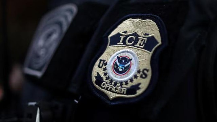 The badge of a U.S. Immigration and Customs Enforcement (ICE) officer. Hawthorne, California, U.S., March 1, 2020. REUTERS/Lucy Nicholson/File Photo Purchase Licensing Rights