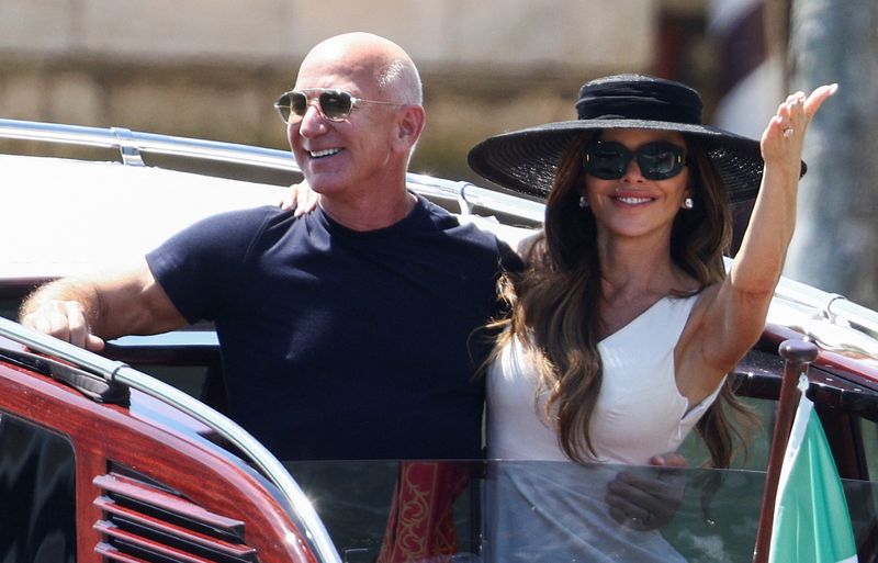 Amazon founder Jeff Bezos and his wife Lauren Sanchez Bezos leave the Aman Venice hotel, in Venice, Italy, June 29, 2025. REUTERS/Guglielmo Mangiapane     TPX IMAGES OF THE DAY