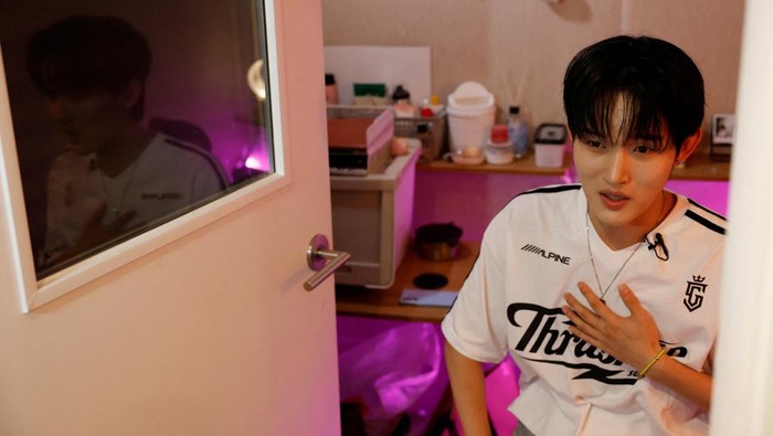 Members of K-pop boy band 1VERSE, including Hyuk and Seok, who defected from North Korea, as well as Aito, Nathan and Kenny, get some rest before they record their new track at a studio in Seoul, South Korea, June 26, 2025. REUTERS/Kim Soo-hyeon