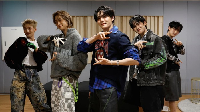 Members of K-pop boy band 1VERSE, including Hyuk and Seok, who defected from North Korea, as well as Aito, Nathan and Kenny, get some rest before they record their new track at a studio in Seoul, South Korea, June 26, 2025. REUTERS/Kim Soo-hyeon