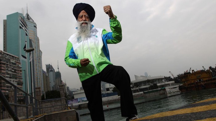 Fauja Singh, who is 100 years old, poses for a photo in Causeway Bay. He will take part in the Standard Chartered Hong Kong Marathon 2012. 02FEB12 (Photo by Sam Tsang/South China Morning Post via Getty Images)