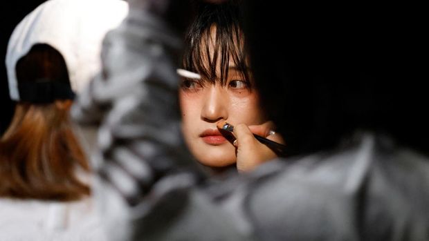Seok, a member of K-pop boy band 1VERSE who defected from North Korea, gets makeup to film a scene for the group's new music video in Seoul, South Korea, May 21, 2025. REUTERS/Kim Soo-hyeon