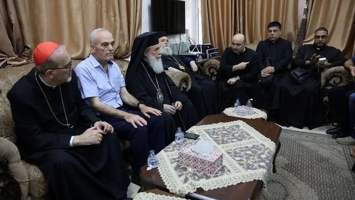 Latin Patriarch of Jerusalem Archbishop Pierbattista Pizzaballa and Greek Orthodox Patriarch of Jerusalem, Theophilos III, meet with parish priest Father Gabriele Romanelli, who suffered light leg injuries following an Israeli strike on the Church of the Holy Family on Thursday, at the the Church of the Holy Family in Gaza City July 18, 2025. (Reuters)