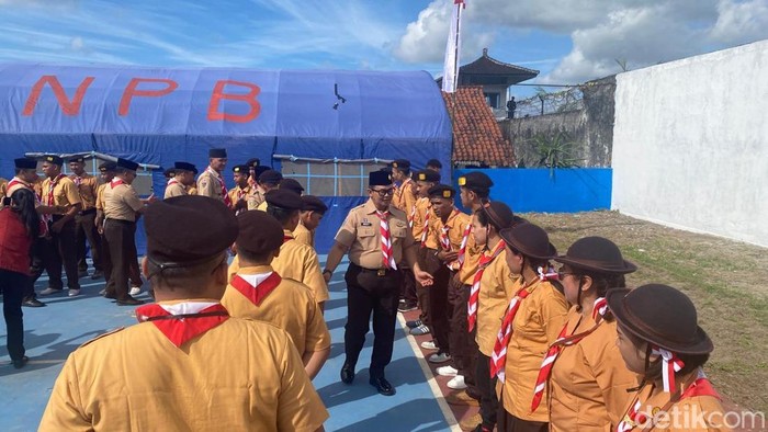 Pembukaan perkemahan Pramuka Satya Dharma Bhakti Pemasyarakatan di Lapas Kelas IIB Karangasem, Sabtu (19/7/2025). (Foto: I Wayan Selamat Juniasa/detikBali)