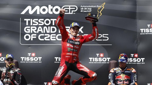 MotoGP - Czech Republic Grand Prix - Masaryk Circuit, Brno, Czech Republic - July 20, 2025 Ducati Lenovo Teams Marc Marquez celebrates with a trophy on the podium after winning the MotoGP race REUTERS/David W Cerny