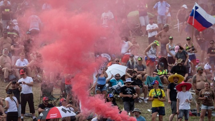 Visitors attend the motorcycle Czech Moto GP Grand Prix sprint race at the Masaryk circuit in Brno, Czech Republic on July 19, 2025. (Photo by Michal Cizek / AFP)