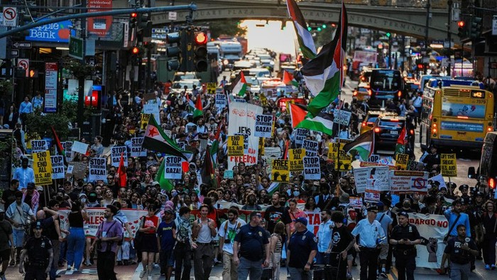 People march as they participate in a 