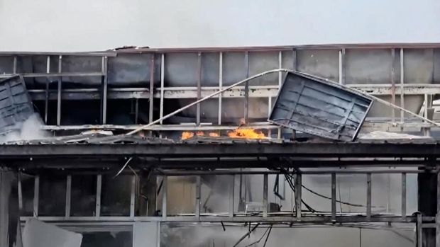 Smoke and fire rise from a convenience store at a gas station, amid the clashes between Thailand and Cambodia, in Kantharalak district, Sisaket province, Thailand, July 24, 2025, in this screengrab obtained from a handout video.  TPBS/Handout via REUTERS    THIS IMAGE HAS BEEN SUPPLIED BY A THIRD PARTY. THAILAND OUT. NO COMMERCIAL OR EDITORIAL SALES IN THAILAND.