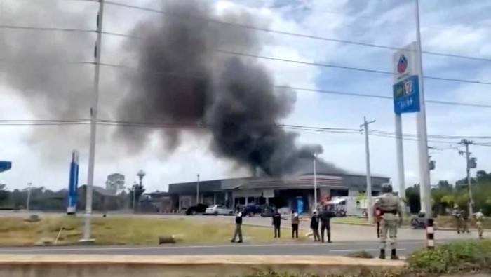 Smoke rises from a convenience store at a gas station, amid the clashes between Thailand and Cambodia, in Kantharalak district, Sisaket province, Thailand, July 24, 2025, in this screengrab obtained from a handout video.  TPBS/Handout via REUTERS    THIS IMAGE HAS BEEN SUPPLIED BY A THIRD PARTY. THAILAND OUT. NO COMMERCIAL OR EDITORIAL SALES IN THAILAND.