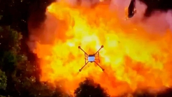 Fire and smoke rise after, what the Thai army says, was the Royal Thai Armys drone operation causing damages on Cambodian militarys arms depot, in an area given as Phu Ma Kuea Hill near Preah Vihear Province, Cambodia, in this screengrab from a handout video released on July 25, 2025. Thai Army/Handout via REUTERS    THIS IMAGE HAS BEEN SUPPLIED BY A THIRD PARTY. NO RESALES. NO ARCHIVES. MANDATORY CREDIT  VERIFICATION - Reuters was not able to independently verify the location and date of footage.       TPX IMAGES OF THE DAY