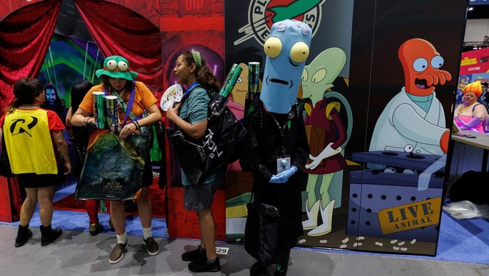 Costumed attendees pose for a picture during opening day of Comic-Con International in San Diego, California, U.S. July 24, 2025.   REUTERS/Mike Blake