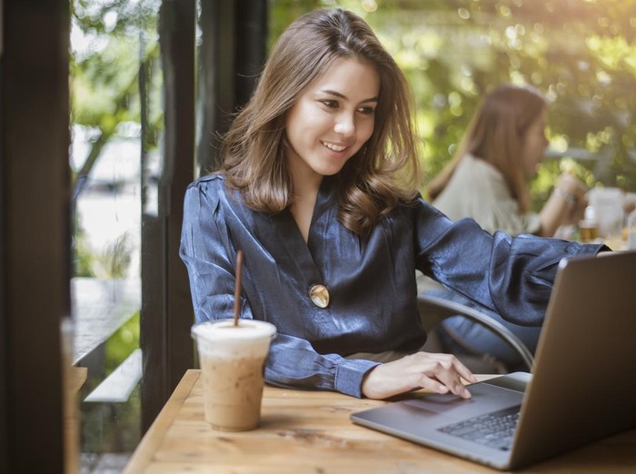 Smart business woman is working with computer