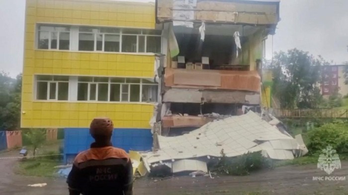 Am emergency services worker looks at a kindergarten damaged by an earthquake, in Petropavlovsk-Kamchatsky, Kamchatka Krai, Russia, July 30, 2025 in this screen grab from handout video.    Russian Ministry for Emergencies/Handout via REUTERS    THIS IMAGE HAS BEEN SUPPLIED BY A THIRD PARTY. DO NOT OBSCURE LOGO.  Verification: - Building, road layout, and building exteriors match file and satellite imagery - Date confirmed by the corroborating local reports and official statements