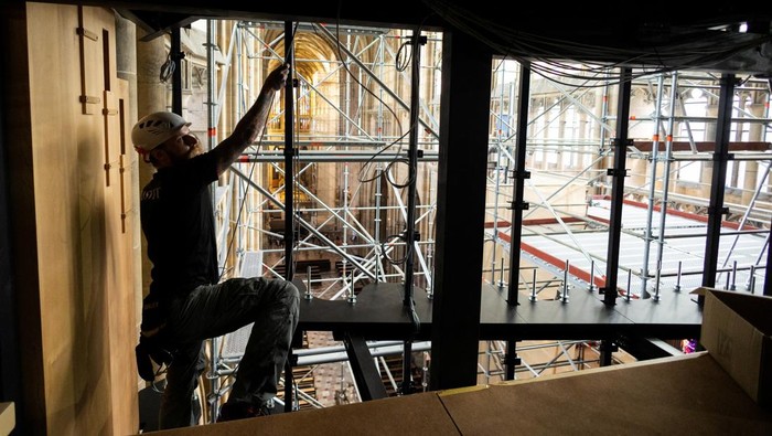 A worker installs parts of a new organ built in El Papiol, Spain, at the workshop of world-renowned organ builder Gerhard Grenzing, in St. Vitus Cathedral at Prague Castle, in Prague, Czech Republic, July 22, 2025. REUTERS/Eva Korinkova
