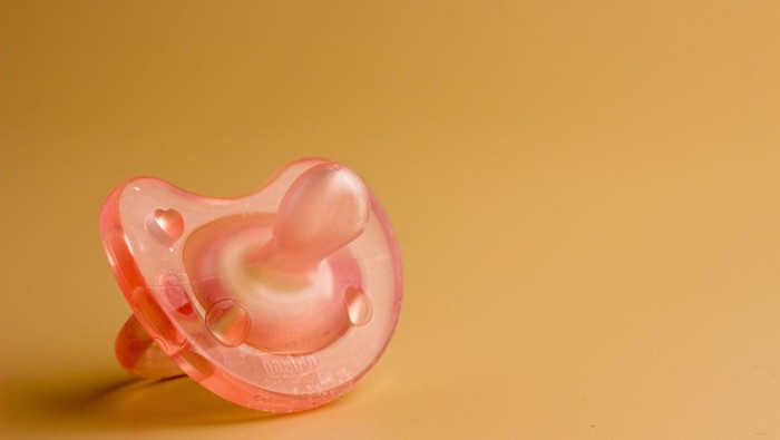 a pacifier for a child on a light background