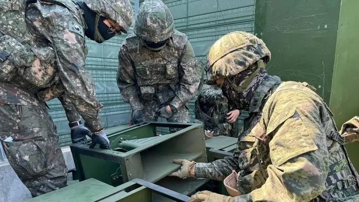 South Korean soldiers work on a loudspeaker that is set up for propaganda broadcasts during a military drill near the demilitarized zone separating the two Koreas in Paju, South Korea, in this handout picture provided by the Defense Ministry and released on June 9, 2024. (Reuters)