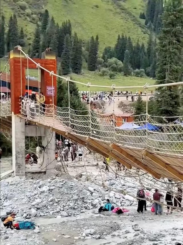 Aftermath of a suspension bridge collapse in Yili, Xinjiang Uyghur Autonomous Region, China in this screen grab obtained from a social media video on date given as August 6, 2025. Social Media/via REUTERS Purchase Licensing Rights