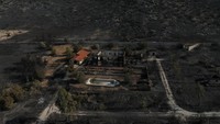 Foto udara menunjukkan lahan hangus akibat kebakaran hutan di Keratea, dekat Athena, Yunani, Sabtu (9/8/2025). REUTERS/Stelios Misinas
