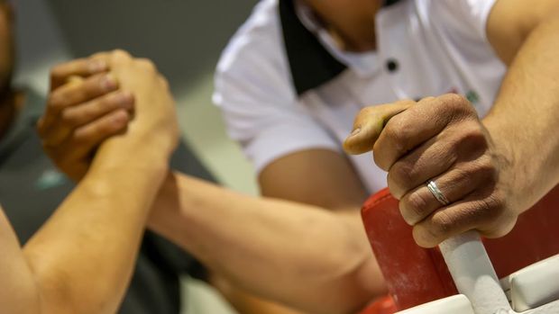 Two men in arm wrestling competition
