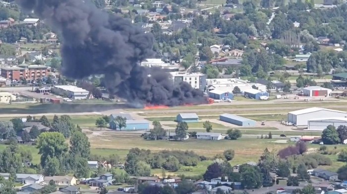 Smoke rises following a plane crash at Kalispell City Airport, in Kalispell, Montana, U.S., August 11, 2025, in this screen grab obtained from a social media video. Scott Carpenter/TMX/via REUTERS  THIS IMAGE HAS BEEN SUPPLIED BY A THIRD PARTY. MANDATORY CREDIT. NO RESALES. NO ARCHIVES.  Verification: -Buildings and airport runway matched file and satellite imagery -Date confirmed by local authorities