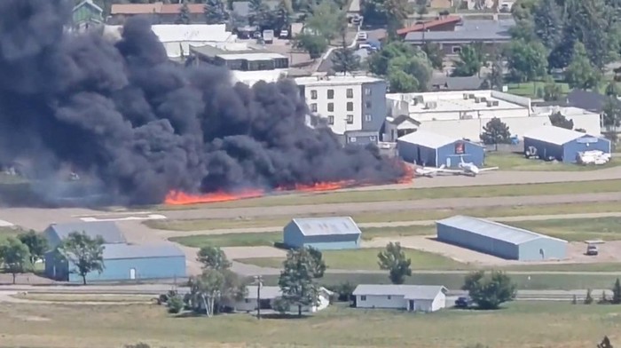 Smoke rises following a plane crash at Kalispell City Airport, in Kalispell, Montana, U.S., August 11, 2025, in this screen grab obtained from a social media video. Scott Carpenter/TMX/via REUTERS  THIS IMAGE HAS BEEN SUPPLIED BY A THIRD PARTY. MANDATORY CREDIT. NO RESALES. NO ARCHIVES.  Verification: -Buildings and airport runway matched file and satellite imagery -Date confirmed by local authorities