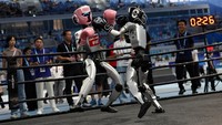 Unitree Robotics humanoid robots compete in a kickboxing match at the inaugural World Humanoid Robot Games, at the National Speed Skating Oval in Beijing, China August 15, 2025. REUTERS/Tingshu Wang     TPX IMAGES OF THE DAY
