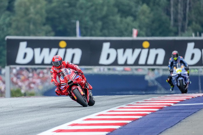 SPIELBERG, AUSTRIA - AUGUST 17: Marc Marquez of Spain and Ducati Lenovo Team leads Fermin Aldeguer of Spain and BK8 Gresini Racing MotoGP during the race of the MotoGP of Austria at the Red Bull Ring on August 17, 2025 in Spielberg, Austria. (Photo by Guenther Iby/SEPA.Media /Getty Images)