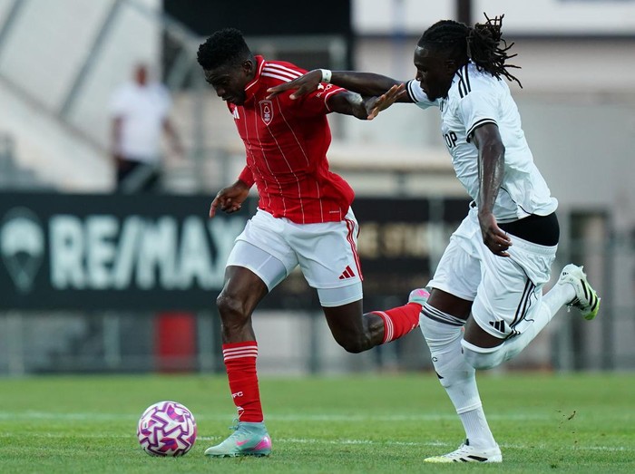 FARO, PORTUGAL - JULY 26: Taiwo Awoniyi of Nottingham Forest with Calvin Bassey of Fulham in action during the Pre-Season Friendly match between Nottingham Forest and Fulham at Estadio Sao Luis on July 26, 2025 in Faro, Portugal.  (Photo by Gualter Fatia/Getty Images)