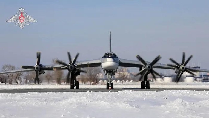 This handout video grab released by the Russian Defence Ministry on February 19, 2022, shows a Russian Tu-95MS bomber aircraft during the Grom-2022 Strategic Deterrence Force exercise at an undefined location in Russia. (AFP)