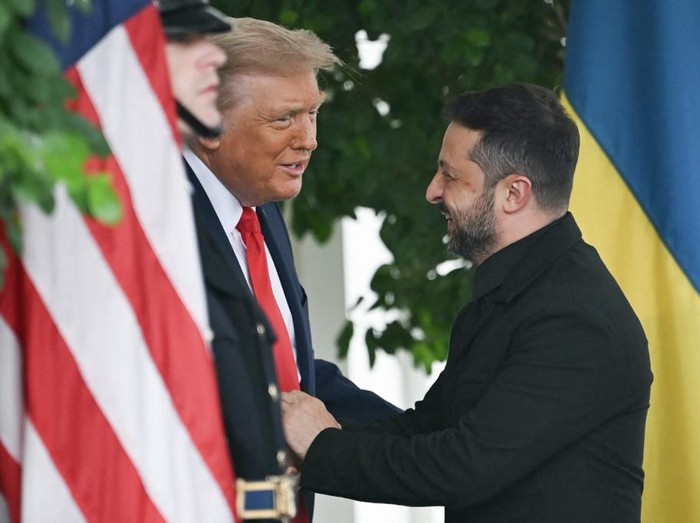 Ukrainian President Volodymyr Zelensky is greeted by US President Donald Trump (L) upon arrival at the White House West Wing in Washington, DC, on August 18, 2025. ANDREW CABALLERO-REYNOLDS / AFP