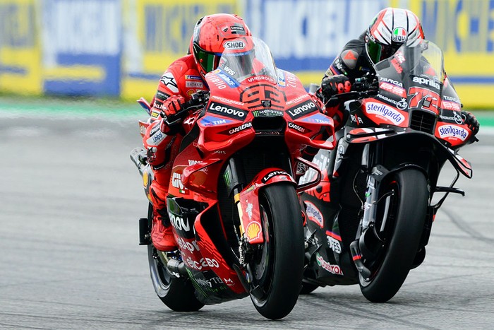 SPIELBERG, AUSTRIA - AUGUST 17: Marc Marquez of Spain riding the Lenovo Ducati (93) and Marco Bezzecchi of Italy riding the Aprilia Racing bike (72) during the MotoGP of Austria race at Red Bull Ring on August 17, 2025 in Spielberg, Austria. (Photo by Gold & Goose Photography/Getty Images)