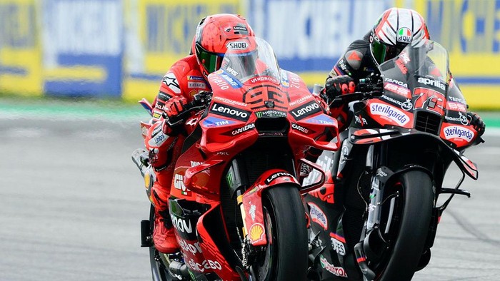 SPIELBERG, AUSTRIA - AUGUST 17: Marc Marquez of Spain riding the Lenovo Ducati (93) and Marco Bezzecchi of Italy riding the Aprilia Racing bike (72) during the MotoGP of Austria race at Red Bull Ring on August 17, 2025 in Spielberg, Austria. (Photo by Gold & Goose Photography/Getty Images)