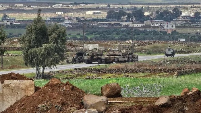 Israeli army tanks and a bulldozer on Syrian territory. (File photo: AFP)