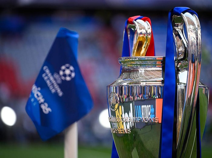 MUNICH, GERMANY - MAY 31: The UEFA Champions League logo on a corner flag and the UEFA Champions League trophy are seen prior to the UEFA Champions League Final 2025 between Paris Saint-Germain and FC Internazionale Milano at Munich Football Arena on May 31, 2025 in Munich, Germany. (Photo by Kevin Voigt/GettyImages)