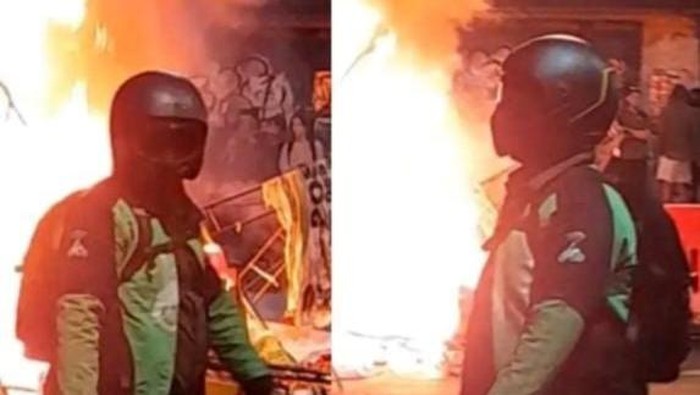Pria berjaket ojol sepatu Adidas Terrex saat Gedung Grahadi Surabaya Dibakar